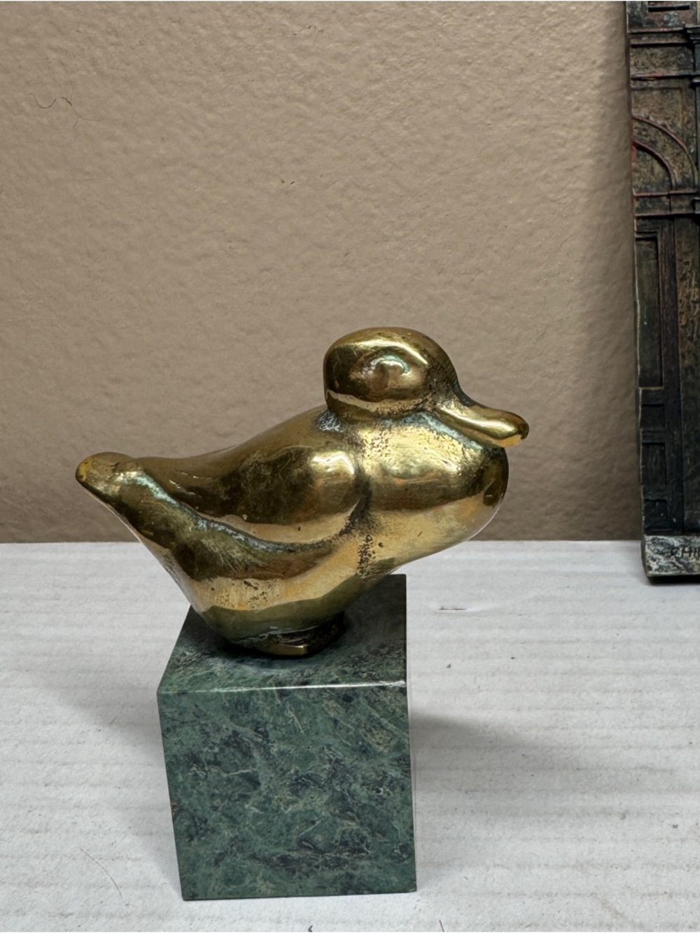 Vintage bras duck with marble pedestal